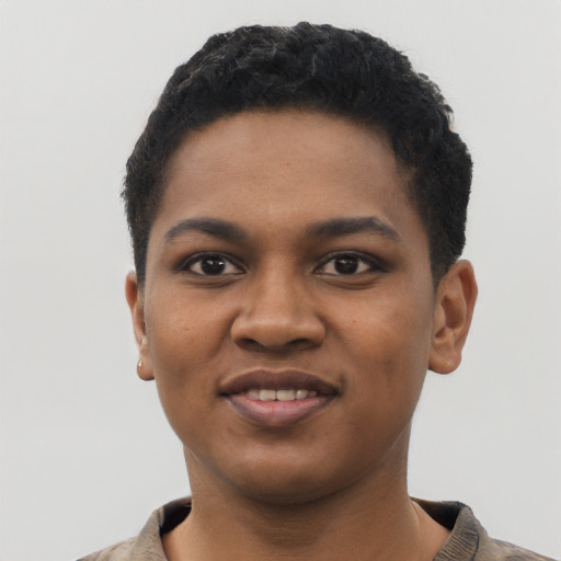 Joyful black young-adult female with short  black hair and brown eyes