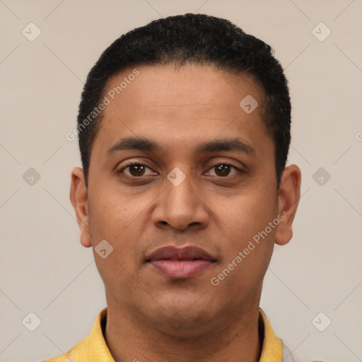 Joyful latino young-adult male with short  black hair and brown eyes