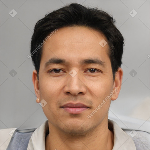 Joyful asian young-adult male with short  black hair and brown eyes