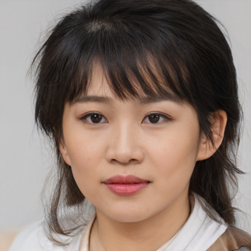 Neutral asian young-adult female with medium  brown hair and brown eyes