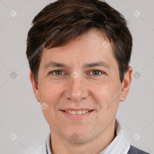 Joyful white adult male with short  brown hair and grey eyes