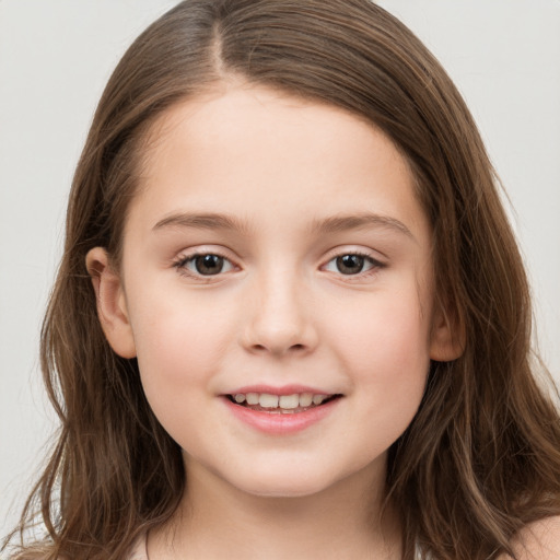 Joyful white child female with long  brown hair and brown eyes