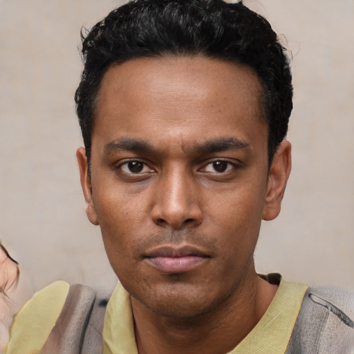 Neutral latino young-adult male with short  black hair and brown eyes