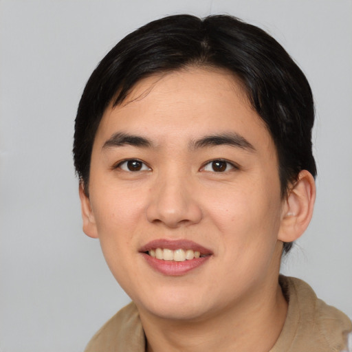 Joyful asian young-adult male with medium  brown hair and brown eyes