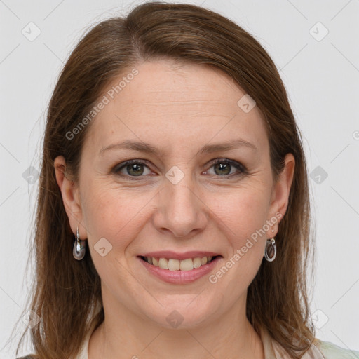 Joyful white adult female with long  brown hair and grey eyes