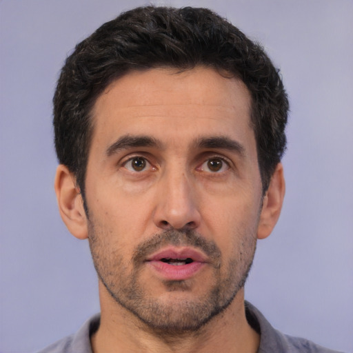 Neutral white adult male with short  black hair and brown eyes