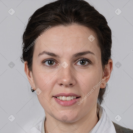 Joyful white adult female with medium  brown hair and brown eyes