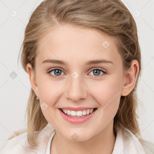 Joyful white young-adult female with medium  brown hair and blue eyes