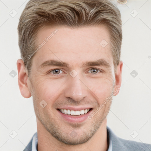 Joyful white adult male with short  brown hair and grey eyes