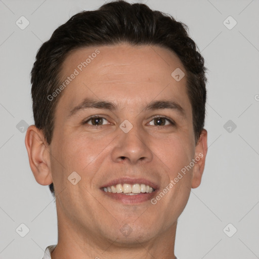 Joyful white adult male with short  brown hair and brown eyes