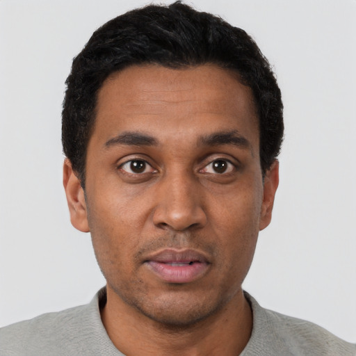 Neutral black young-adult male with short  black hair and brown eyes