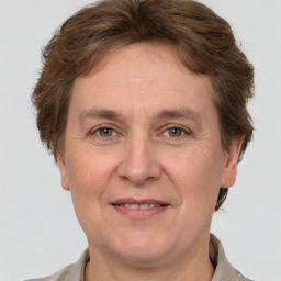 Joyful white adult female with short  brown hair and grey eyes