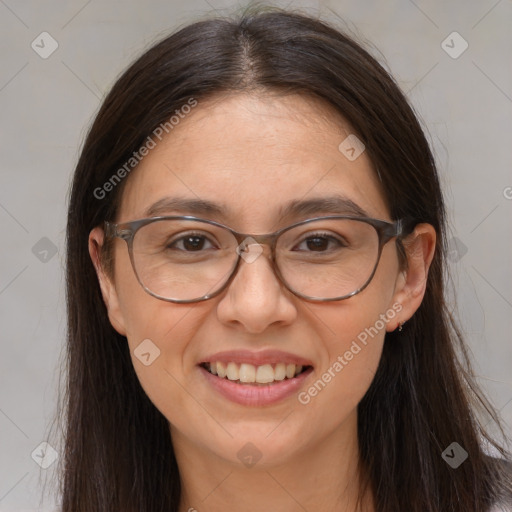 Joyful white adult female with long  brown hair and brown eyes