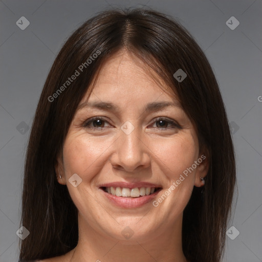 Joyful white adult female with medium  brown hair and brown eyes