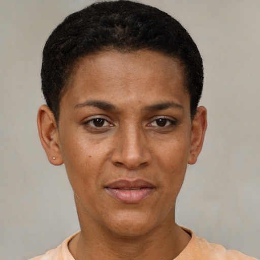 Joyful black young-adult female with short  black hair and brown eyes