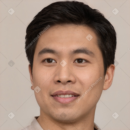 Joyful asian young-adult male with short  black hair and brown eyes