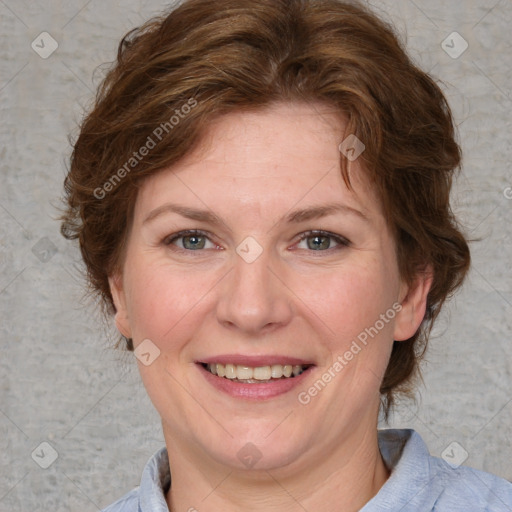 Joyful white adult female with medium  brown hair and blue eyes