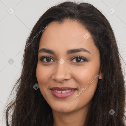 Joyful latino young-adult female with long  brown hair and brown eyes