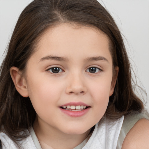 Joyful white child female with medium  brown hair and brown eyes