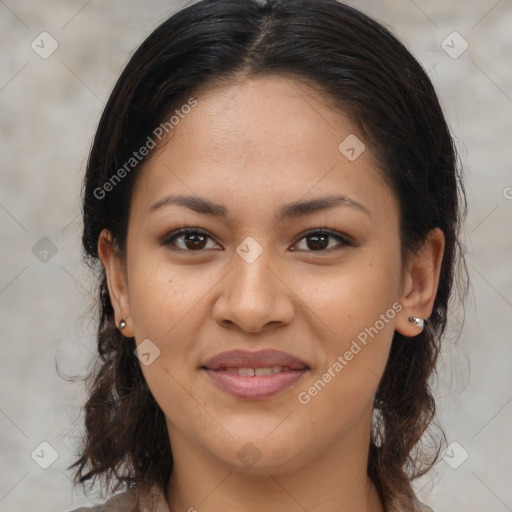 Joyful latino young-adult female with medium  brown hair and brown eyes