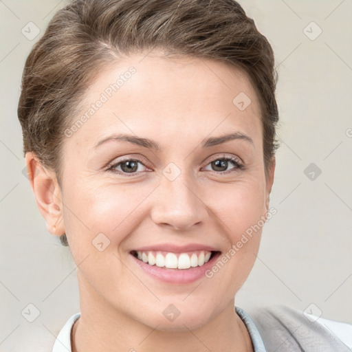 Joyful white young-adult female with short  brown hair and brown eyes