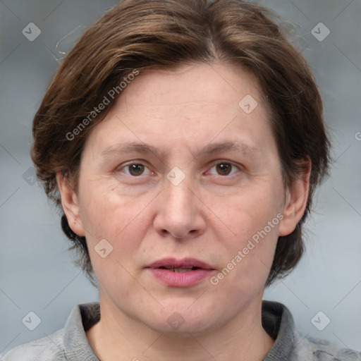 Joyful white adult female with medium  brown hair and grey eyes