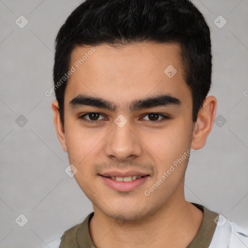 Joyful latino young-adult male with short  brown hair and brown eyes