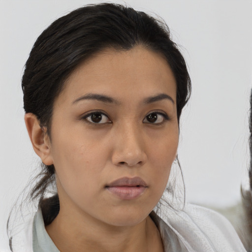 Neutral latino young-adult female with medium  brown hair and brown eyes