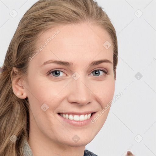 Joyful white young-adult female with long  brown hair and blue eyes