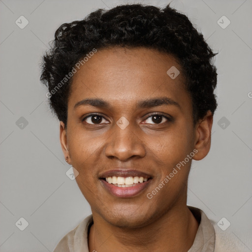 Joyful black young-adult female with short  brown hair and brown eyes