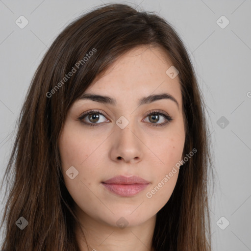 Neutral white young-adult female with long  brown hair and brown eyes