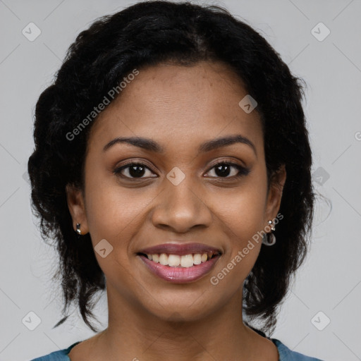 Joyful black young-adult female with short  black hair and brown eyes