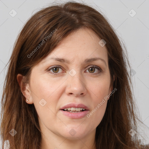 Joyful white adult female with long  brown hair and brown eyes