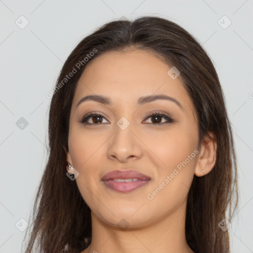 Joyful latino young-adult female with long  brown hair and brown eyes