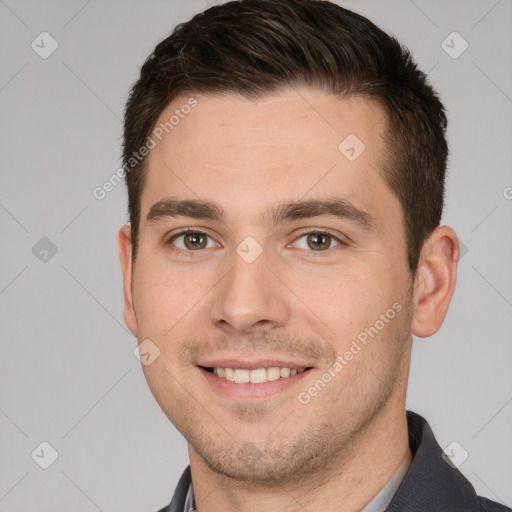 Joyful white young-adult male with short  brown hair and brown eyes