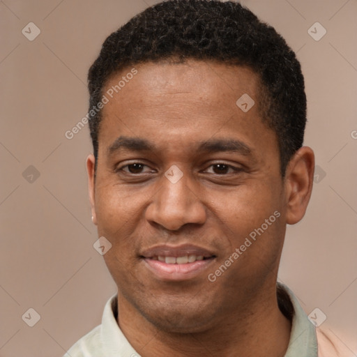 Joyful latino young-adult male with short  brown hair and brown eyes
