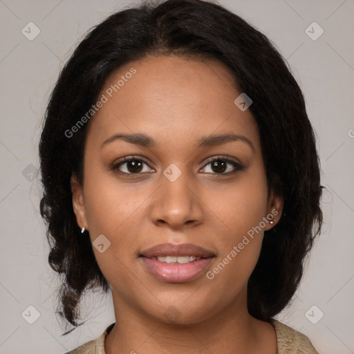 Joyful black young-adult female with medium  brown hair and brown eyes