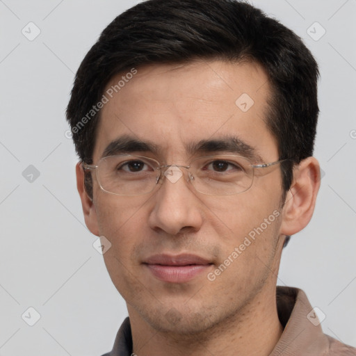 Joyful white adult male with short  black hair and brown eyes