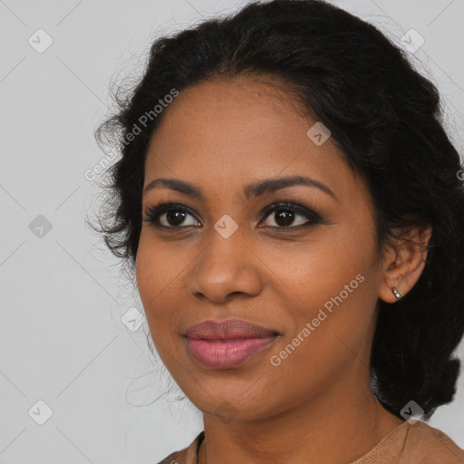 Joyful black young-adult female with long  brown hair and brown eyes