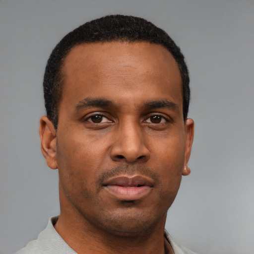 Neutral latino young-adult male with short  brown hair and brown eyes