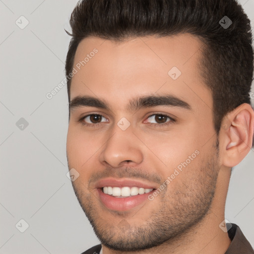 Joyful white young-adult male with short  brown hair and brown eyes