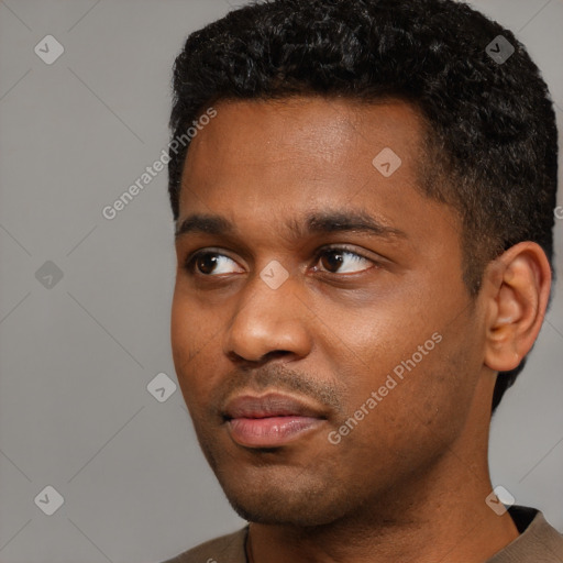 Neutral black young-adult male with short  black hair and brown eyes