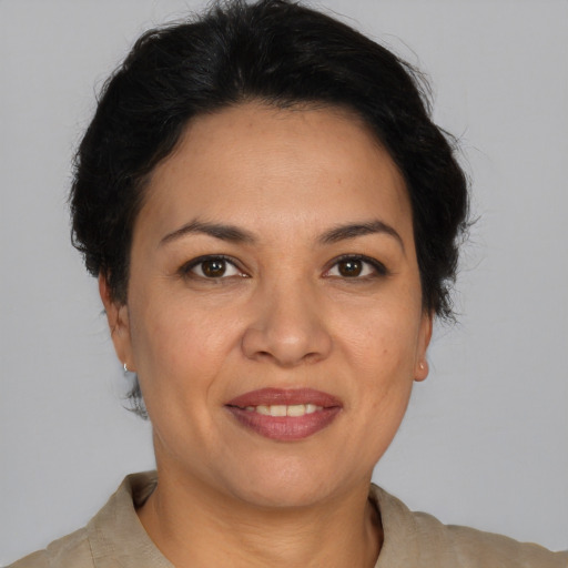 Joyful white adult female with short  brown hair and brown eyes