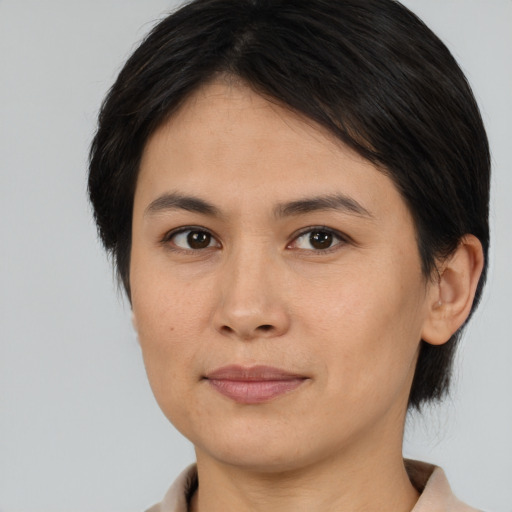 Joyful white young-adult female with medium  brown hair and brown eyes