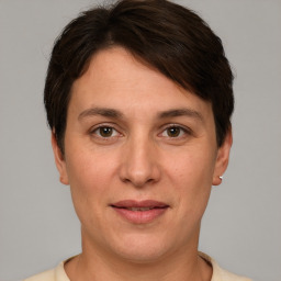 Joyful white adult female with short  brown hair and brown eyes