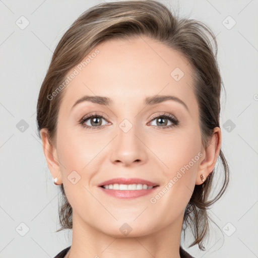 Joyful white young-adult female with medium  brown hair and grey eyes