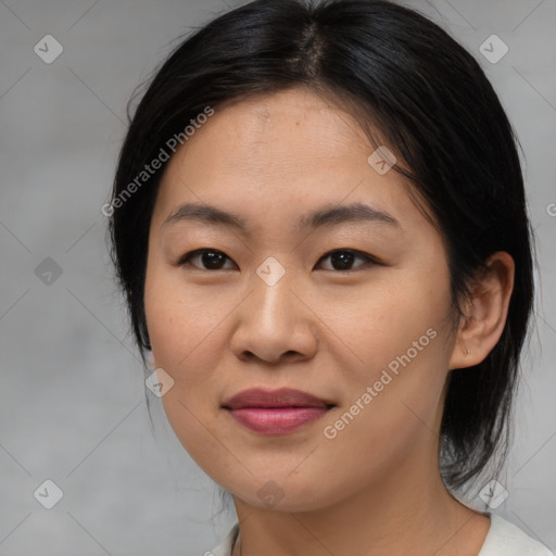 Joyful asian young-adult female with medium  brown hair and brown eyes