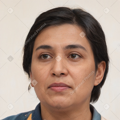 Joyful white adult female with medium  brown hair and brown eyes