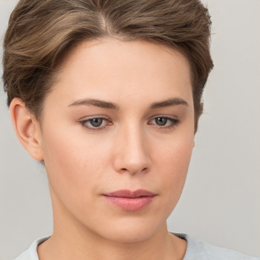 Neutral white young-adult female with short  brown hair and brown eyes