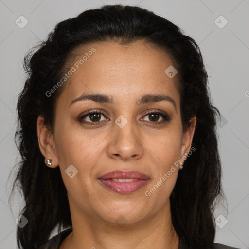 Joyful latino adult female with medium  brown hair and brown eyes